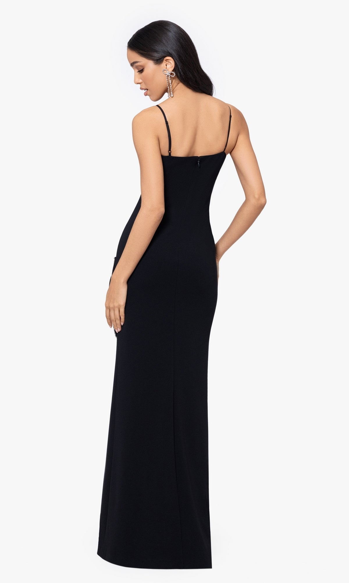 A woman models the Long Prom Dress 5063BN by Blondie Nites, featuring a fitted silhouette and thin straps, standing with her back to the camera against a plain white background.